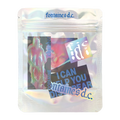A silver resealable pouch with stickers inside.
